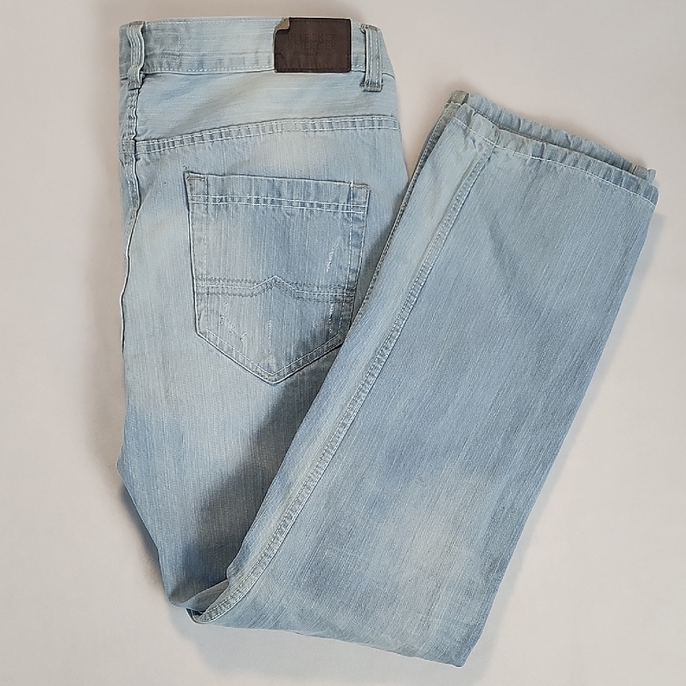 Blue Bootcut Jeans with Faded Appearance and Visible Stitching